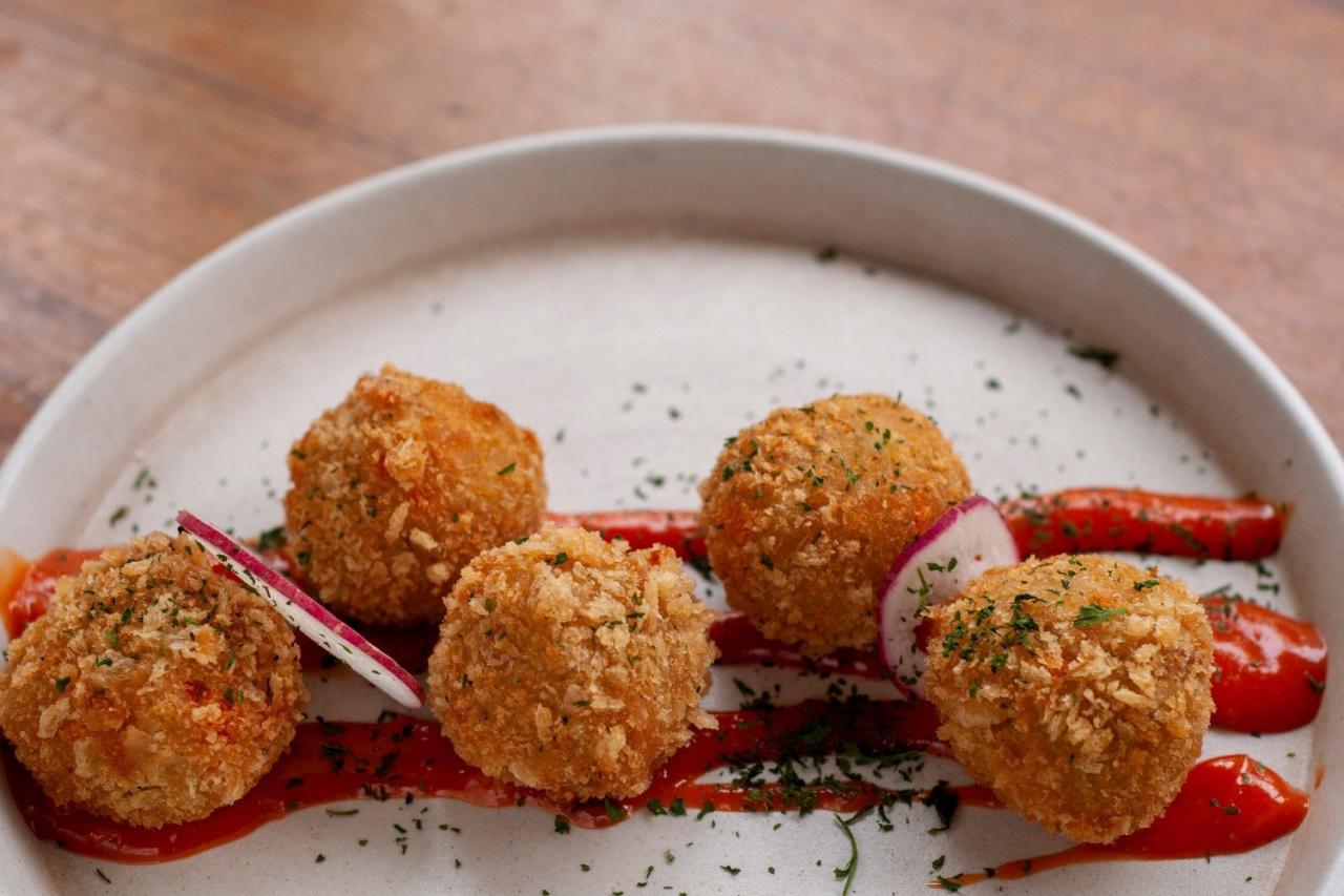Potato Croquettes with Mint and Pecorino Cheese on Red Pepper Cream