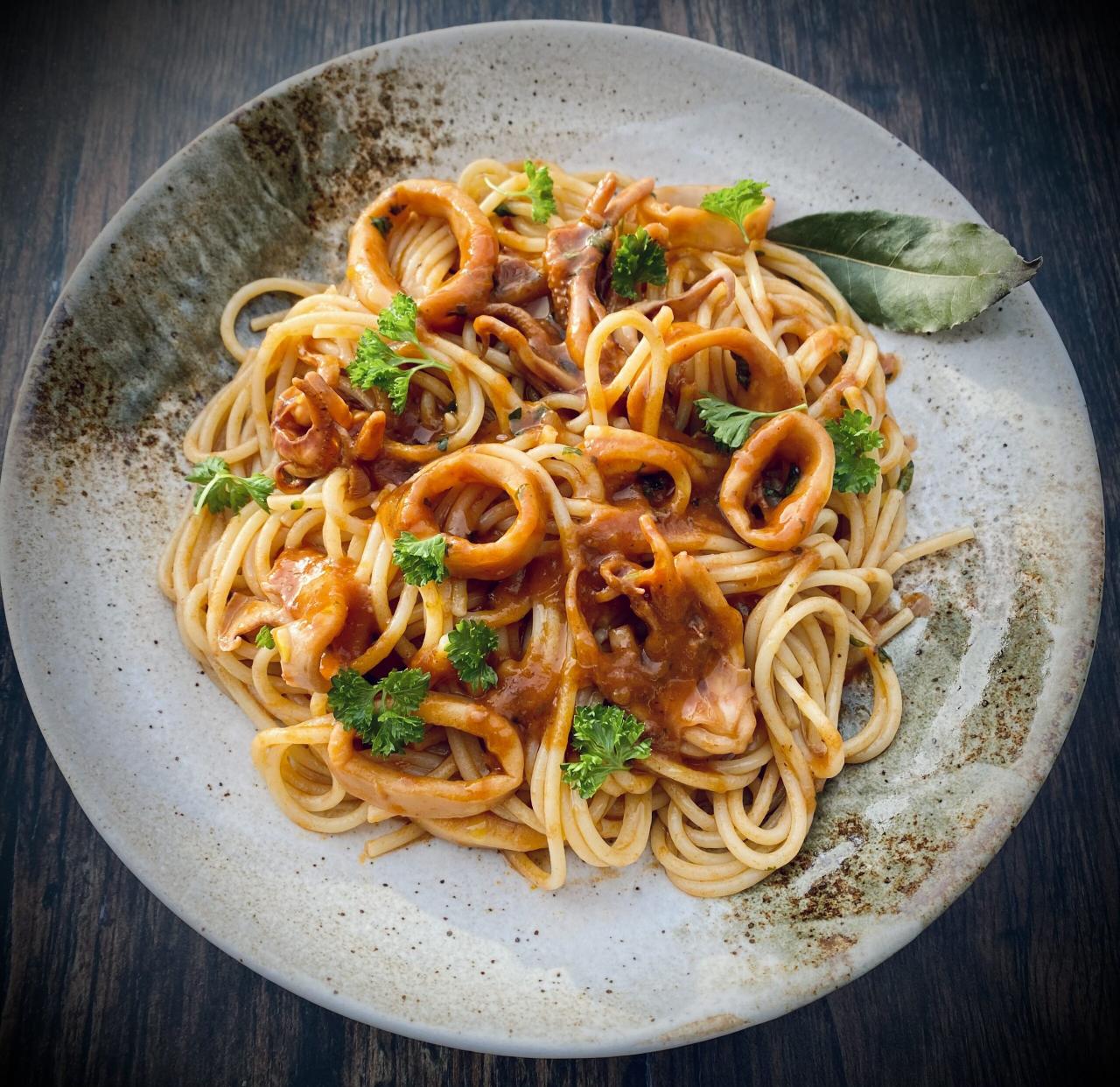 Spaghetti with calamari in an aromatic tomato sauce - Irini Tzortzoglou